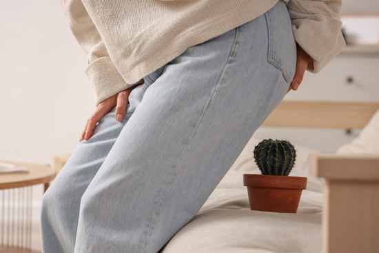 tush discomfort - picture of person about to sit on a cactus plant